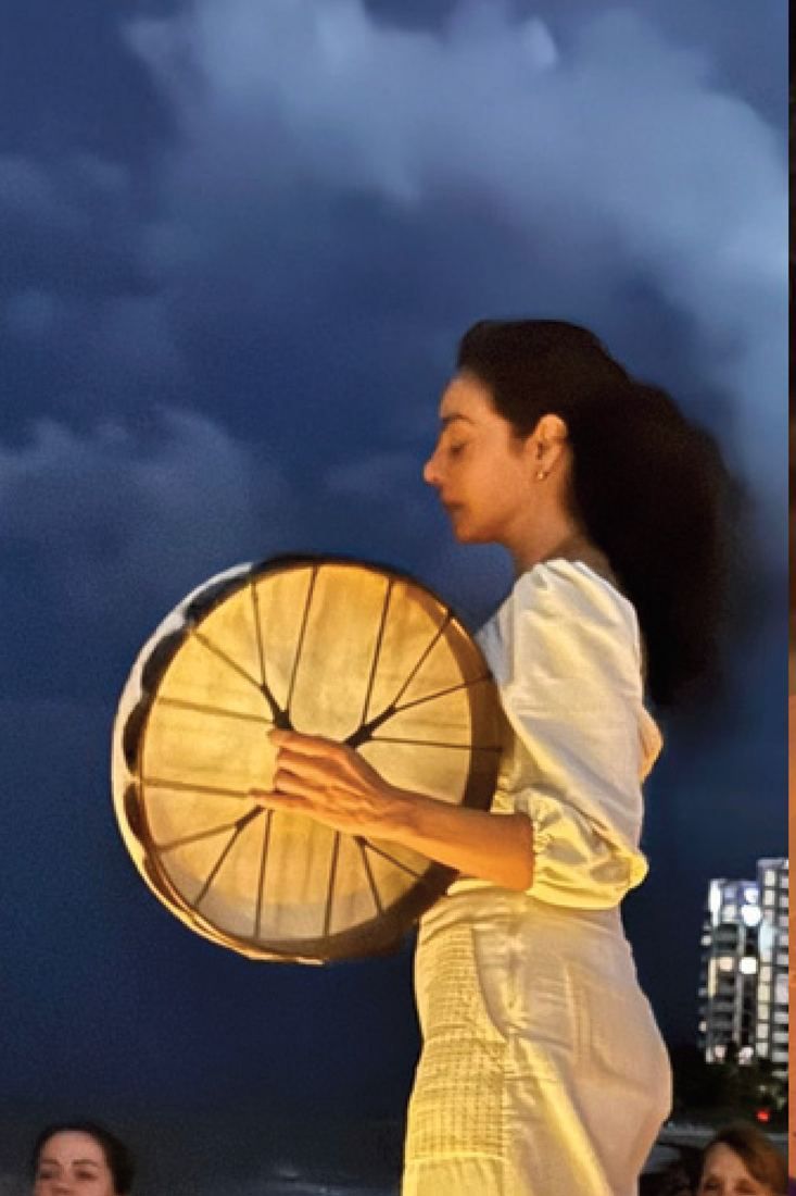 A drum held up against the sky